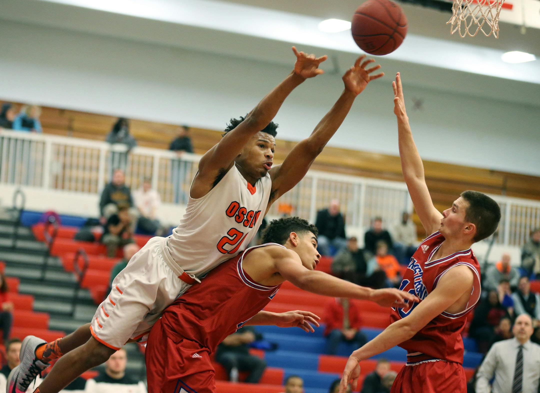 Osseo Damario Armstrong shoots over the back of Armstrong's High True Thompson , and Jon Nelson (right) in the seconded half Tuesday January 5,2016 in Plymouth, MN. ] Osseo beat Robbinsdale Armstrong 79-76 in boys basket . Jerry Holt/Jerry.Holt@Startribune.com