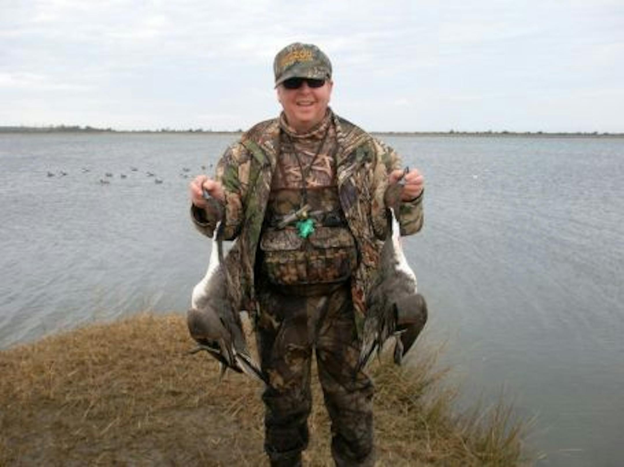 Dr. Payne shows off a pair of pintails