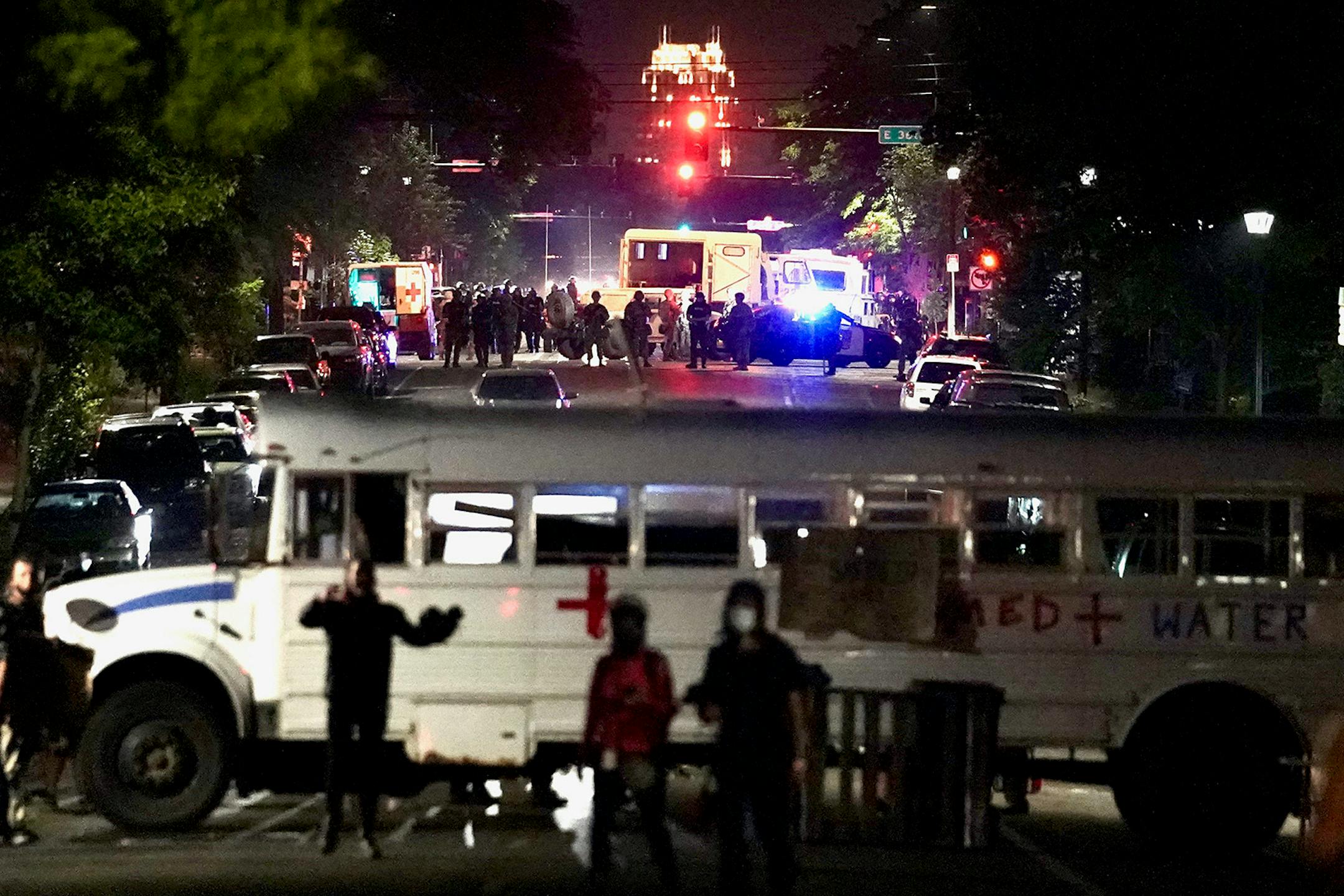 The National Guard and other authorities arrive after curfew near Cup Foods early Tuesday morning.
