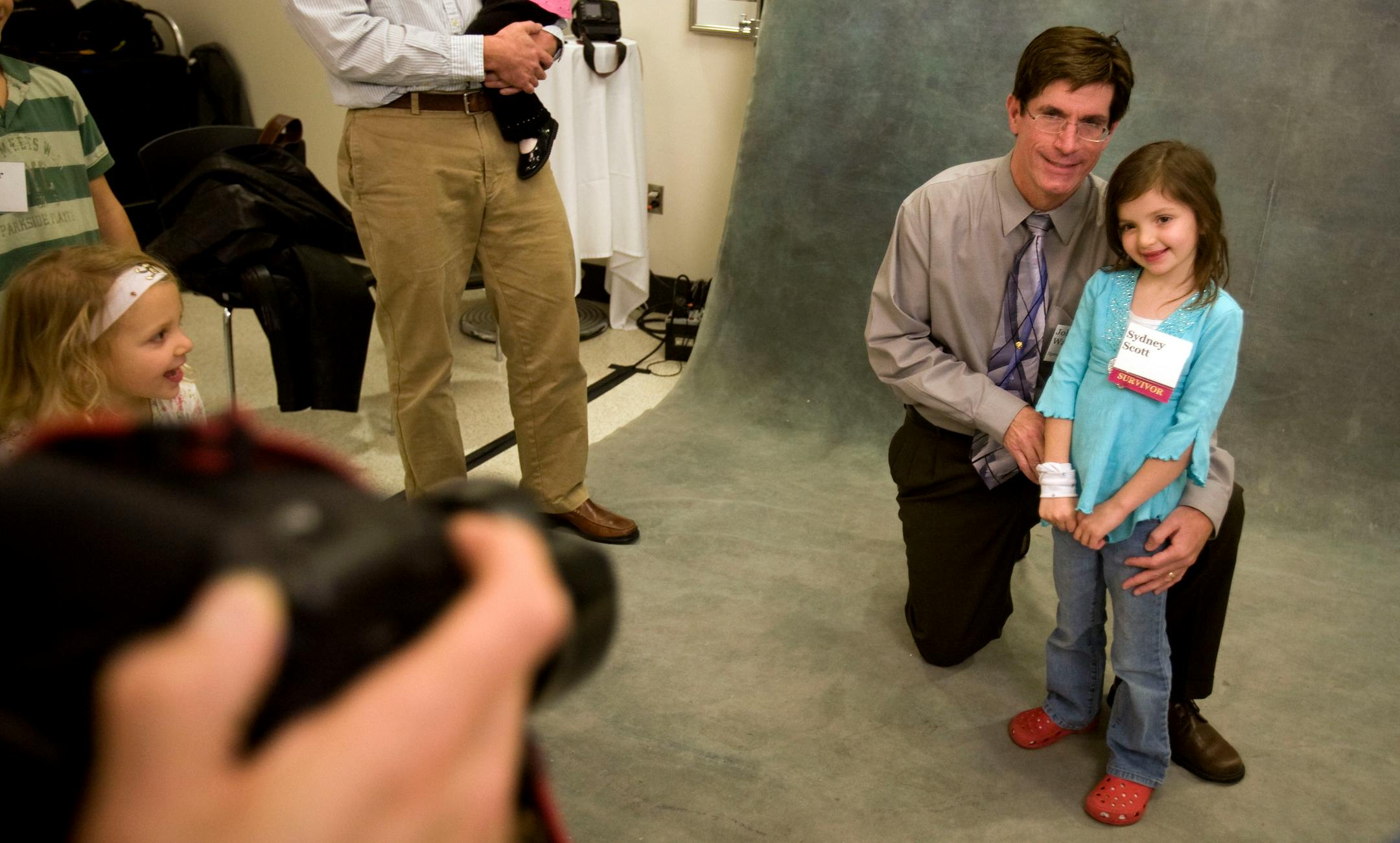 Dr. John Wagner posed for a picture with his former patient, Sydney Scott, 6, of Lake Elmo, at a celebration of the 40th anniversary of the world's first bone marrow transplant. The event was held at the University of Minnesota for doctors, nurses, survivors and their families. Scott was only 13 weeks old when Dr. Wagner started treatment.