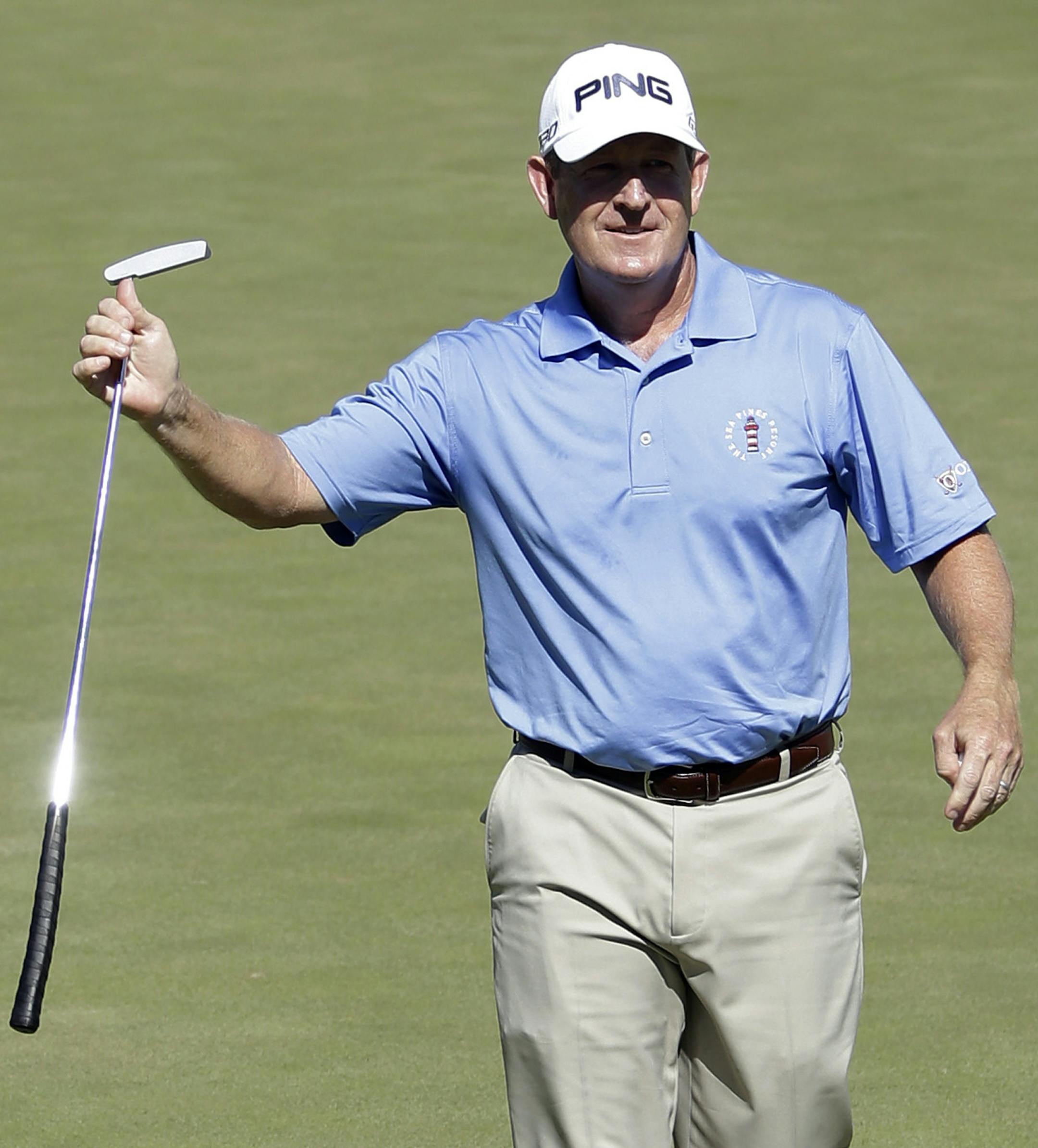 Jeff Maggert raises his putter after sinking his putt on the 18th hole to win the U.S. Senior Open golf tournament at Del Paso Country Club in Sacramento, Calif., Sunday, June 28, 2015. (AP Photo/Rich Pedroncelli)