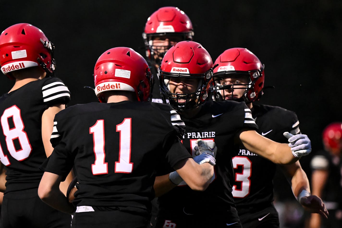 Shakopee wide receiver Brayden Kleine (15), right of center, celebrates with wide receiver Luca Ratkovich (11) after Ratkovich scored a first quarter touchdown against Shakopee Friday, Sept. 22, 2023 at Eden Prairie High School in Eden Prairie, Minn. ] AARON LAVINSKY • aaron.lavinsky@startribune.com