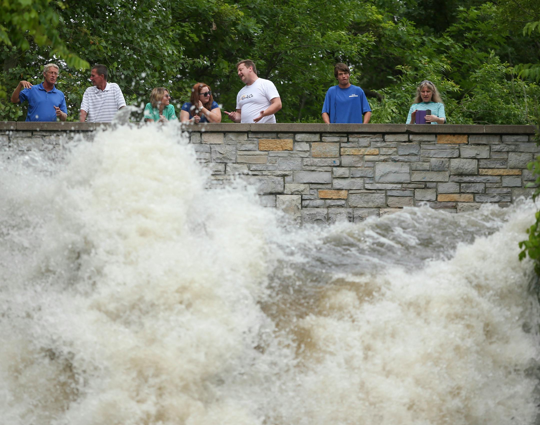 going over the 53 foot drop of a raging Minnehaha Falls Thursday afternoon, July 19, 2014. ] JEFF WHEELER • jeff.wheeler@startribune.com Hunt Jennings, 20, a sponsored professional kayaker from Chattanooga, TN , in what was likely a first descent, went over Minnehaha Falls in a kayak Thursday afternoon, to the surprise of dozens of people watching the raging water.