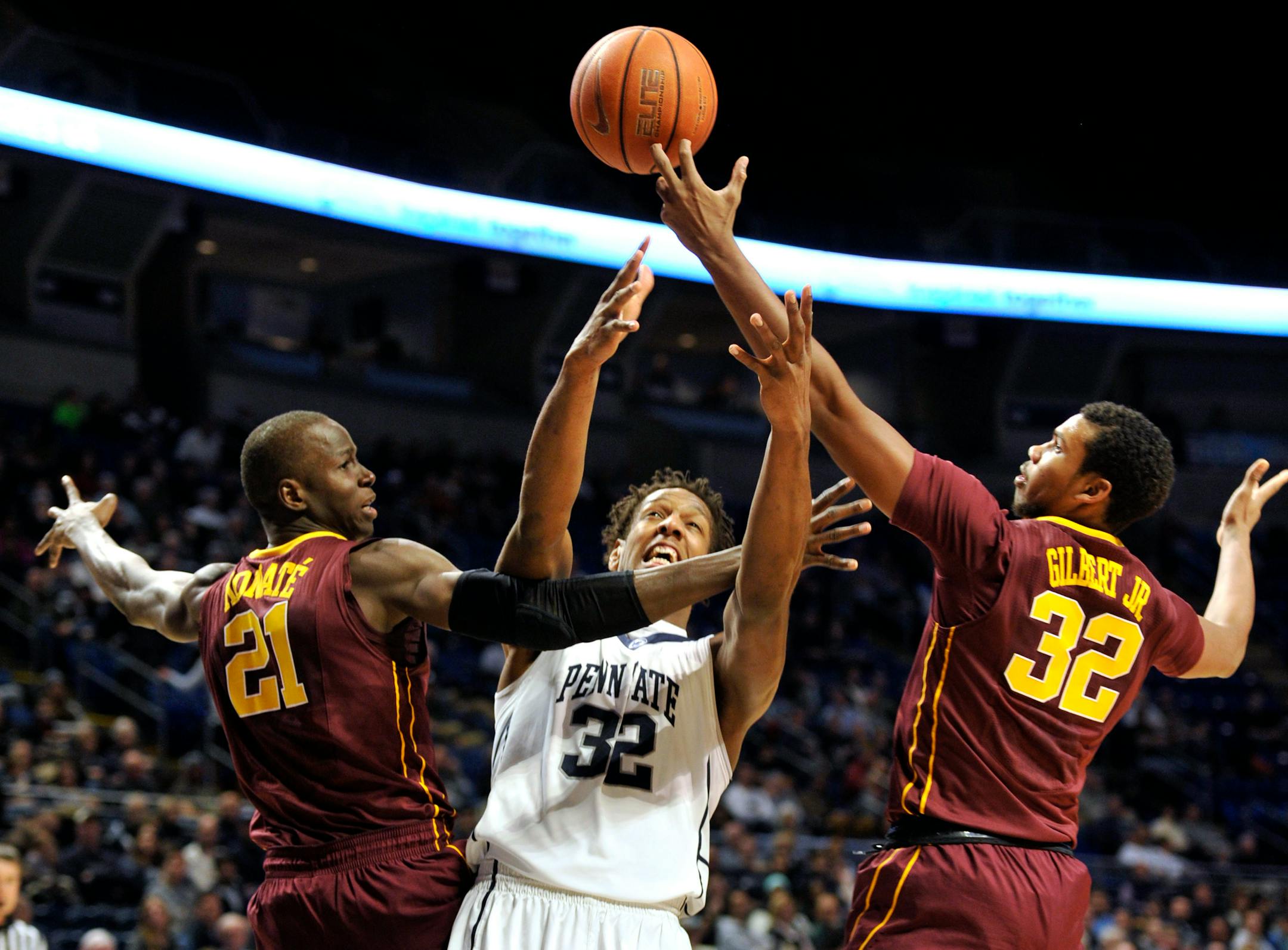Penn State's Jordan Dickerson (32) fights for the ball with Minnesota's Bakary Konate (21) and Ahmad Gilbert (32) at the Bryce Jordan Center in University Park, Pa., on Tuesday, Jan. 5, 2016. (Nabil K. Mark/Centre Daily Times/TNS)