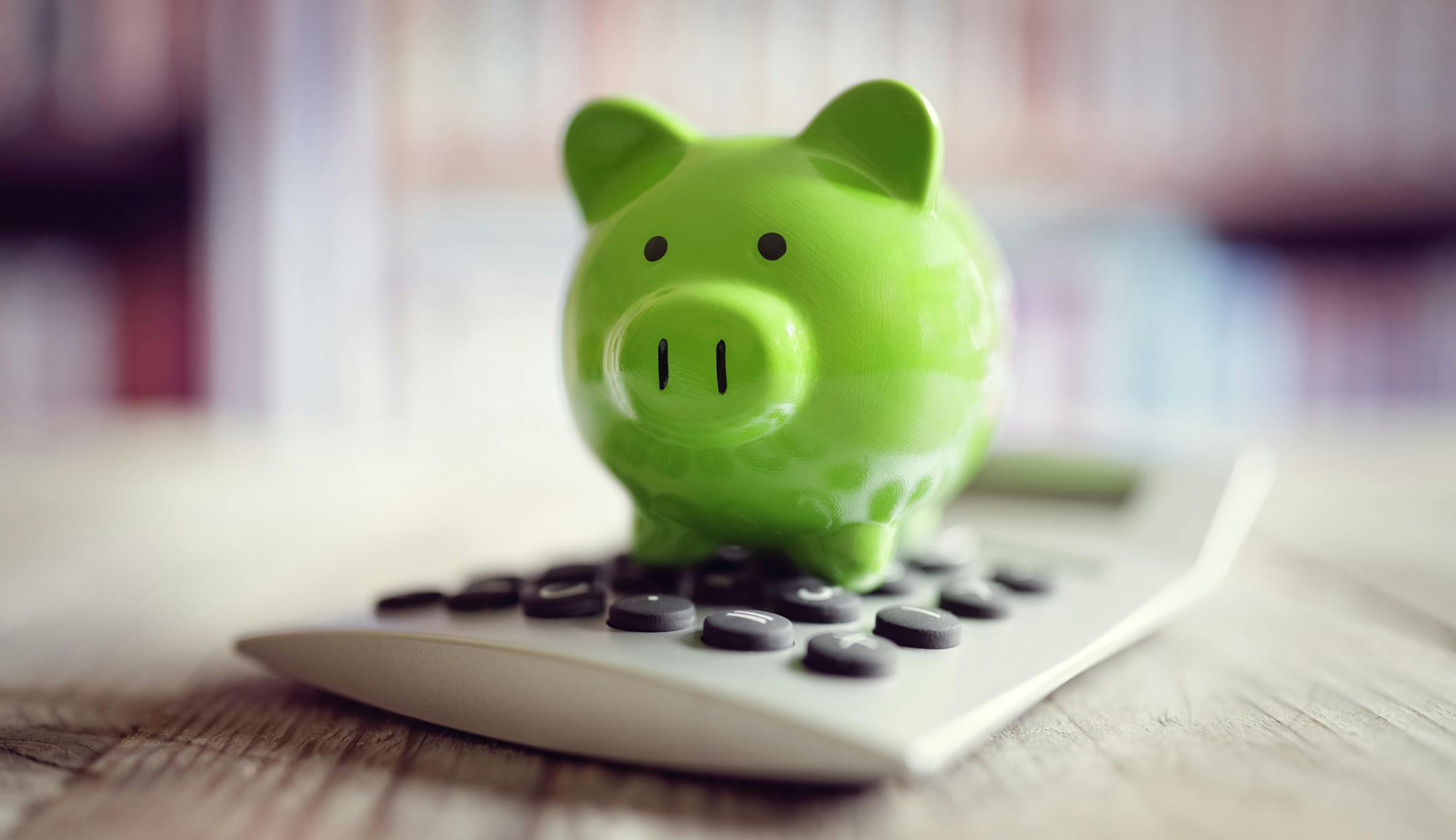 Piggy bank on calculator concept for saving, accounting, banking and business account. istock