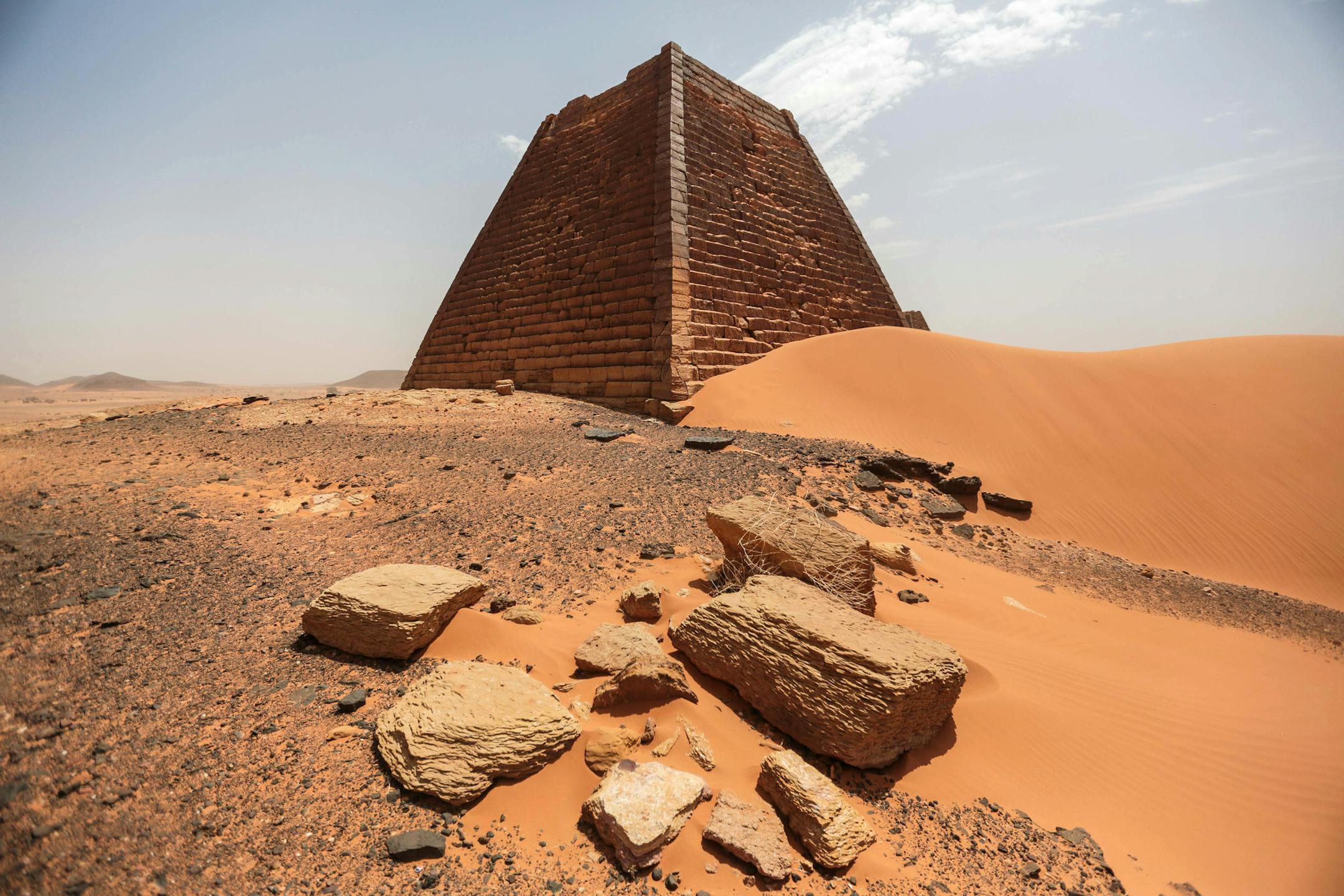 In this Thursday, April 16, 2015 photo, a view of the historic Meroe pyramids in al-Bagrawiya, 200 kilometers (125 miles) north of Khartoum, Sudan. The steep, small pyramids rise over the desert hills, a stunning reminder of the ancient Nubian kingdom that once ruled Egypt _ and ones not nearly as visited as those of its neighbor. (AP Photo/Mosa'ab Elshamy)