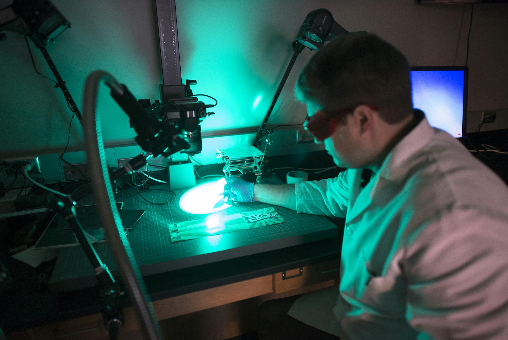 Forensic scientist Ryan Coller demonstrated an alternate light source in revealing a latent finger print at the Anoka County forensic lab. ] noLAB_080614 567278 20035624A Anoka County's forensic lab has been accredited. They are only the third lab in the state accredited in DNA. They also do toxicology, drug chemistry and latent prints. It's a joint effort between Sherburne and Wright counties. DAVIDBREWSTER/STAR TRIBUNE