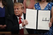 President Donald Trump held up an executive order he signed Thursday requiring colleges to certify that their policies support free speech as a condit