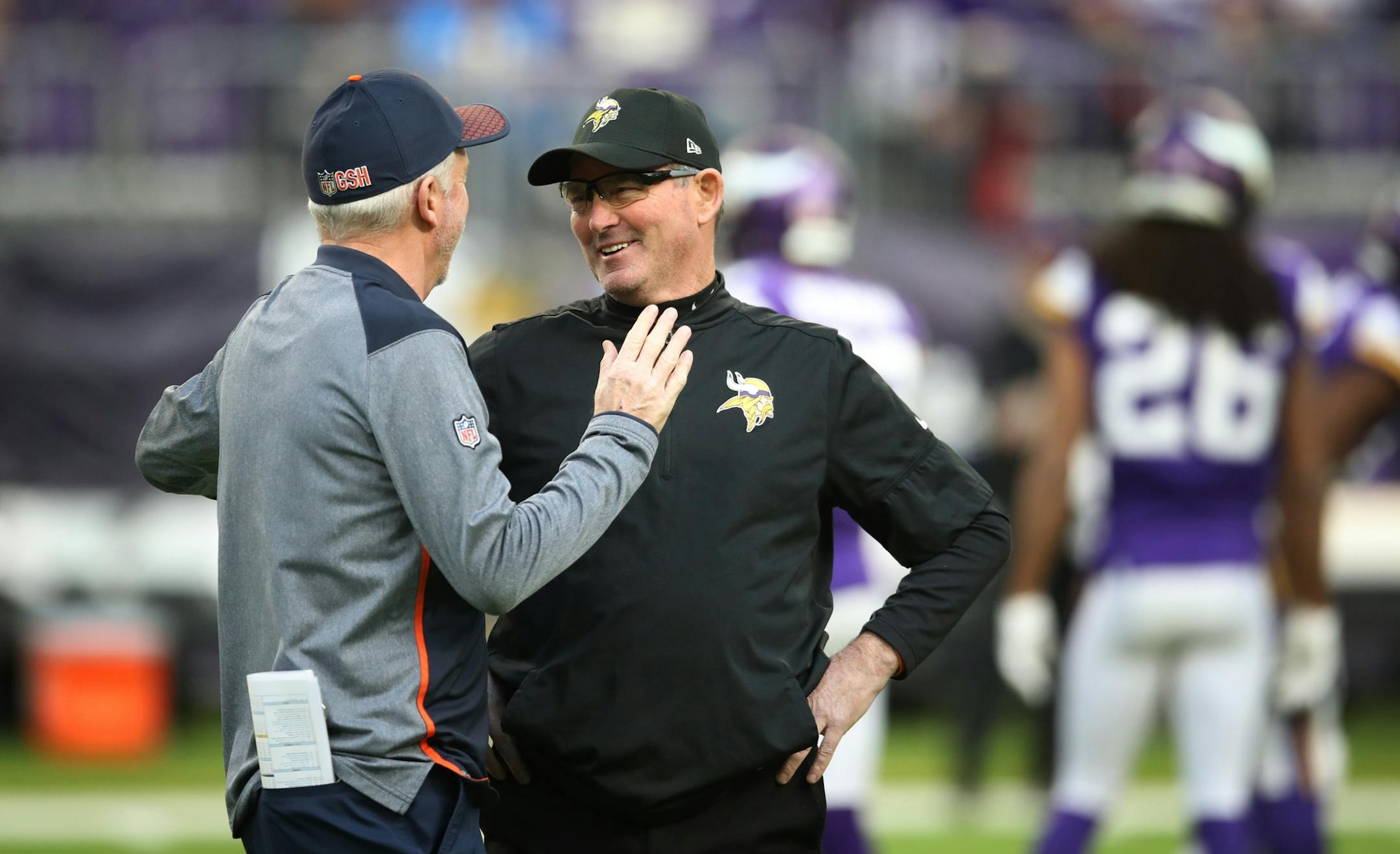 Chicago Bears head coach John Fox left and Minnesota Vikings head coach Mike Zimmer talked before kick off at U.S. Bank Stadium Sunday December 31, 2017 in Minneapolis, MN.