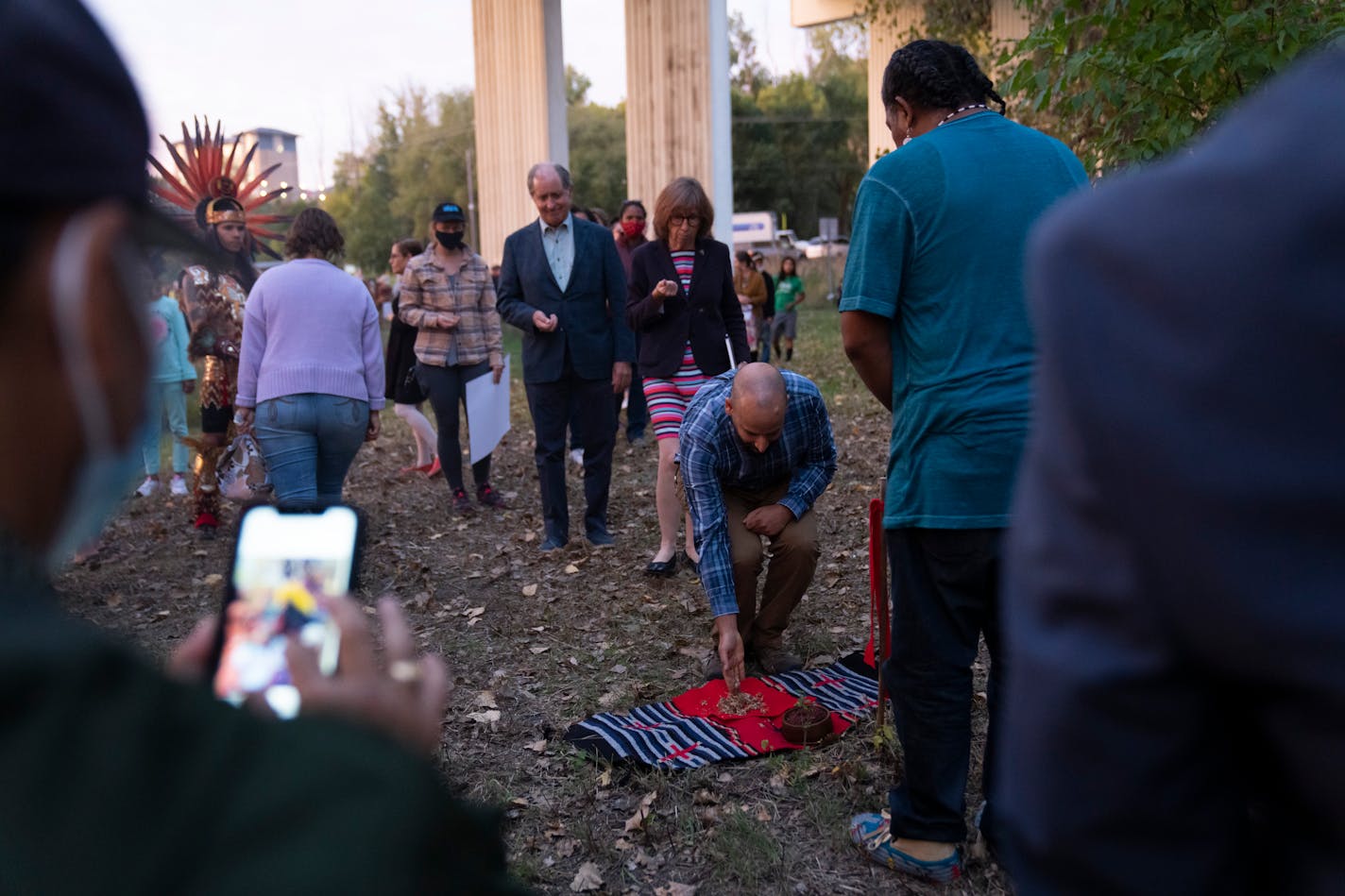 Guests one by one placed tobacco on the land that will house the new Wakan Tipi Center at the end of an Indigenous Peoples Day ceremony held to dedicate and honor the land for the future Wakan Tipi Center in St. Paul, Minn., on Monday, October 11, 2021.