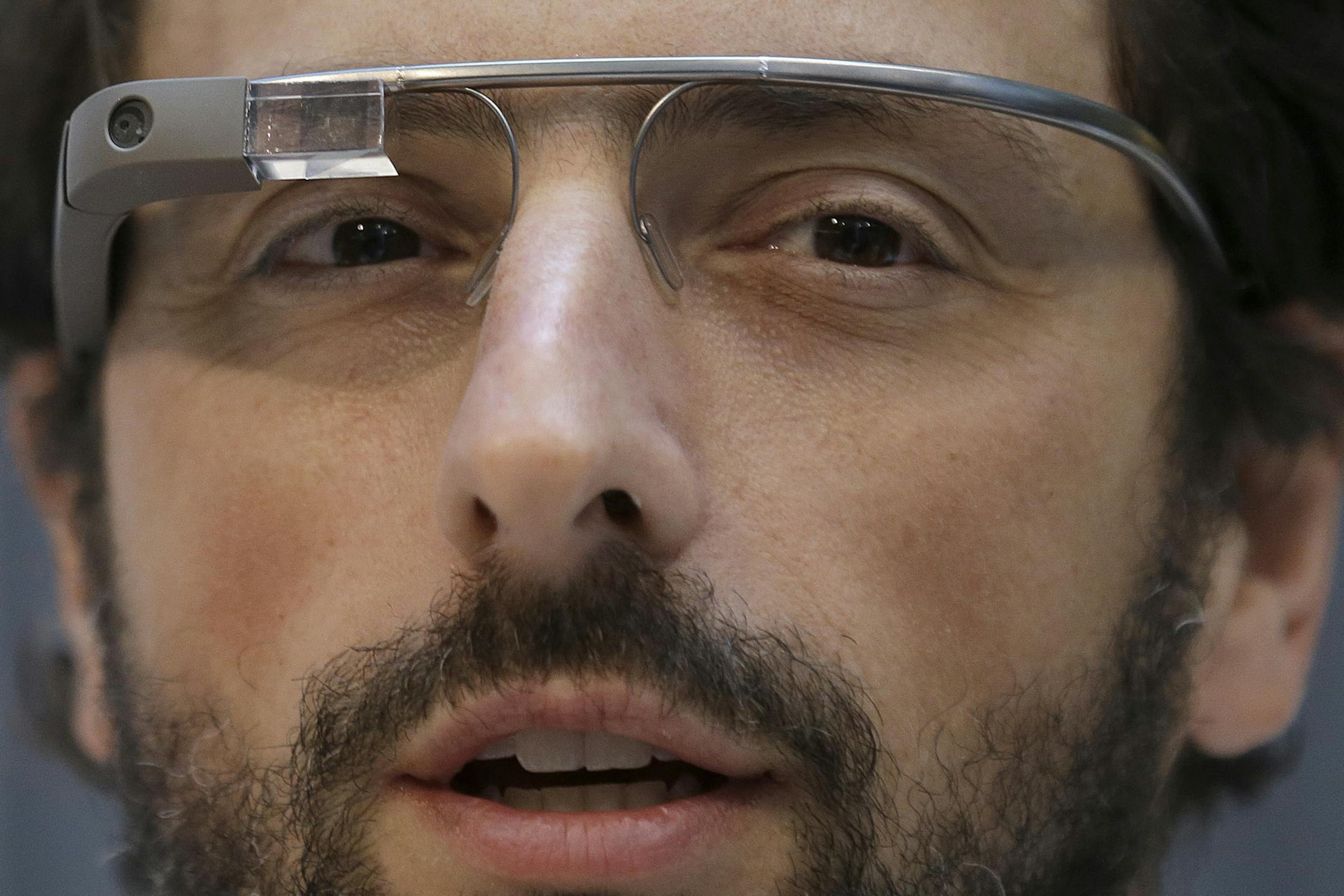 Google co-founder Sergey Brin wears Google Glass glasses at an announcement for the Breakthrough Prize in Life Sciences at Genentech Hall on UCSF&#xed;s Mission Bay campus in San Francisco, Wednesday, Feb. 20, 2013. (AP Photo/Jeff Chiu)