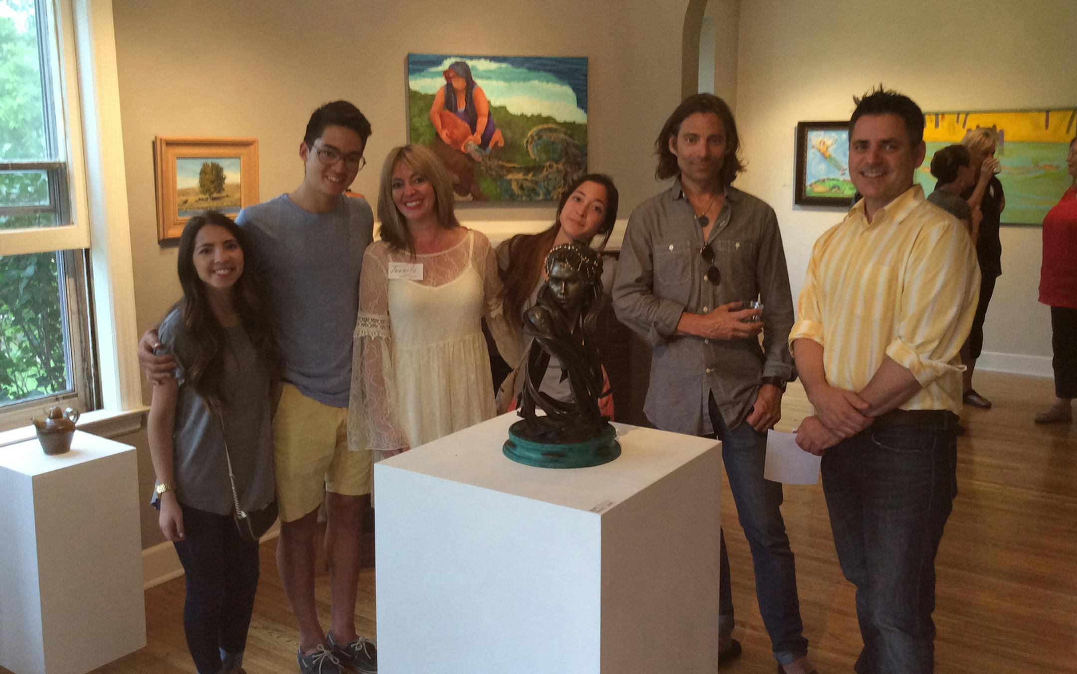 James Shoop (right) received the River Moon Award for his bronze sculpture ìRamautarî at the ArtReach St. Croix Members Show opening reception this month. The award was selected and funded by the IkutaSchodde Family Foundation members (left to right) Cecelia, Quentin, Juanita, Karina and Geoff.