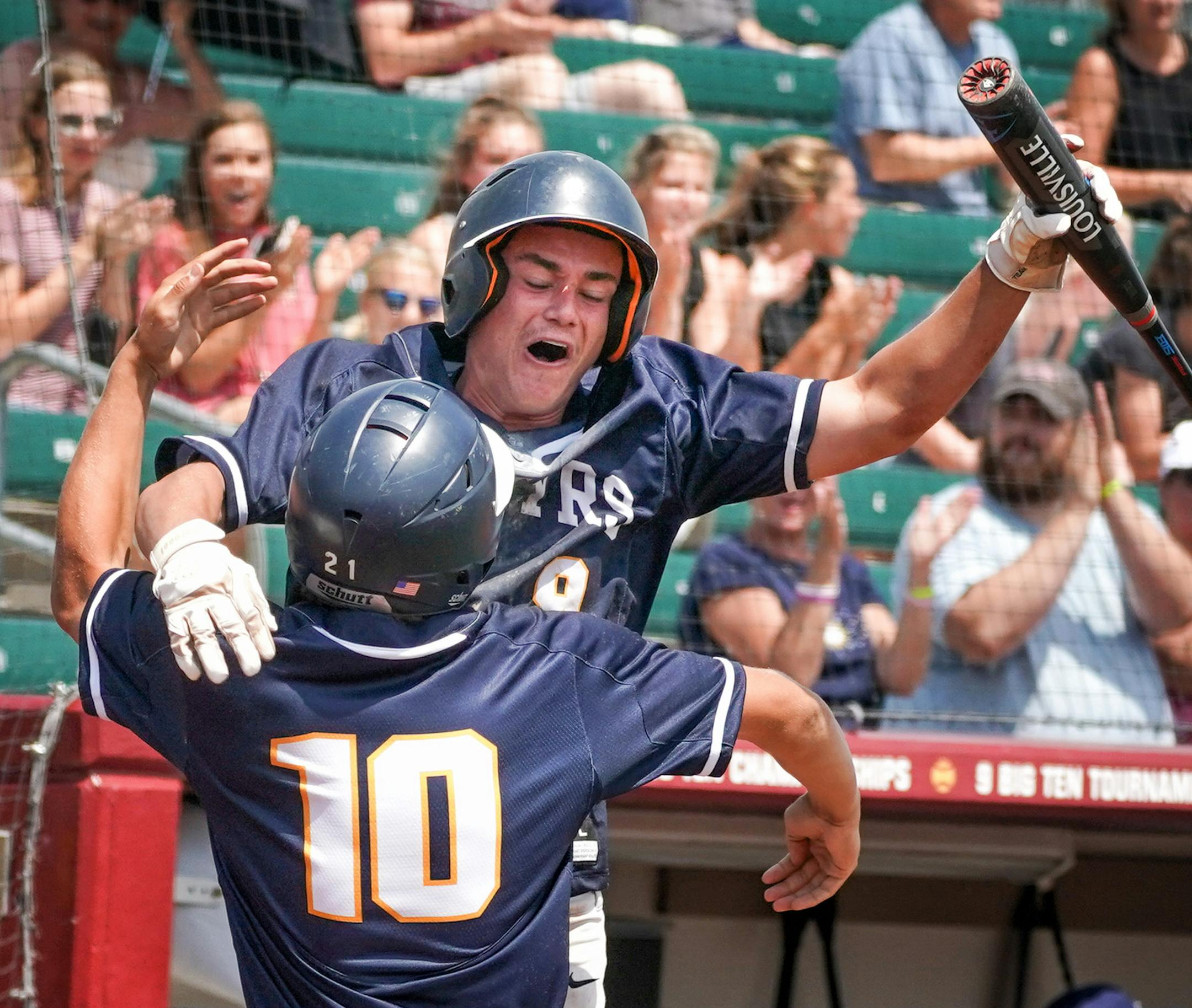 A passed ball allowed Mahtomedi Brandon Anderson (10) to score the only run of the game. He was congratulated by Jamie Berg (9). ] GLEN STUBBE • glen.stubbe@startribune.com Friday, June 15, 2018 Class 3A baseball state semifinal game action where Mahtomedi beat Alexandria 1-0 in the first game.