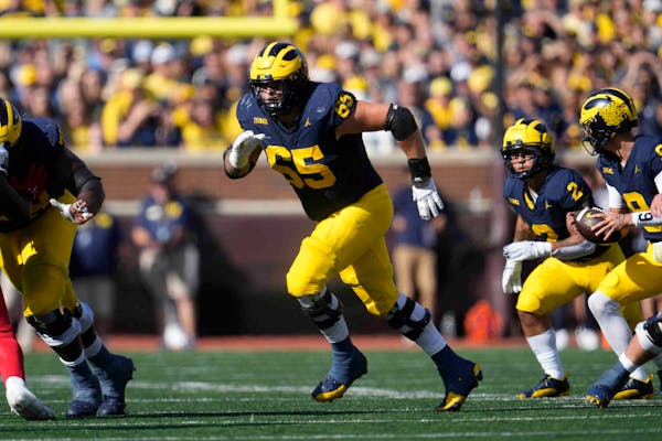 Michigan offensive lineman Zak Zinter (65) played against UNLV in Ann Arbor, Mich., on Sept. 9. The Wolverines have won the Joe Moore Award, given to 