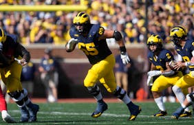 Michigan offensive lineman Zak Zinter (65) played against UNLV in Ann Arbor, Mich., on Sept. 9. The Wolverines have won the Joe Moore Award, given to