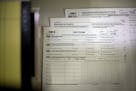 FILE - In this Wednesday, Dec. 30, 2015, file photo, new IRS forms 1095B and 1095C, for employer provided health insurance or for use if a taxpayer go