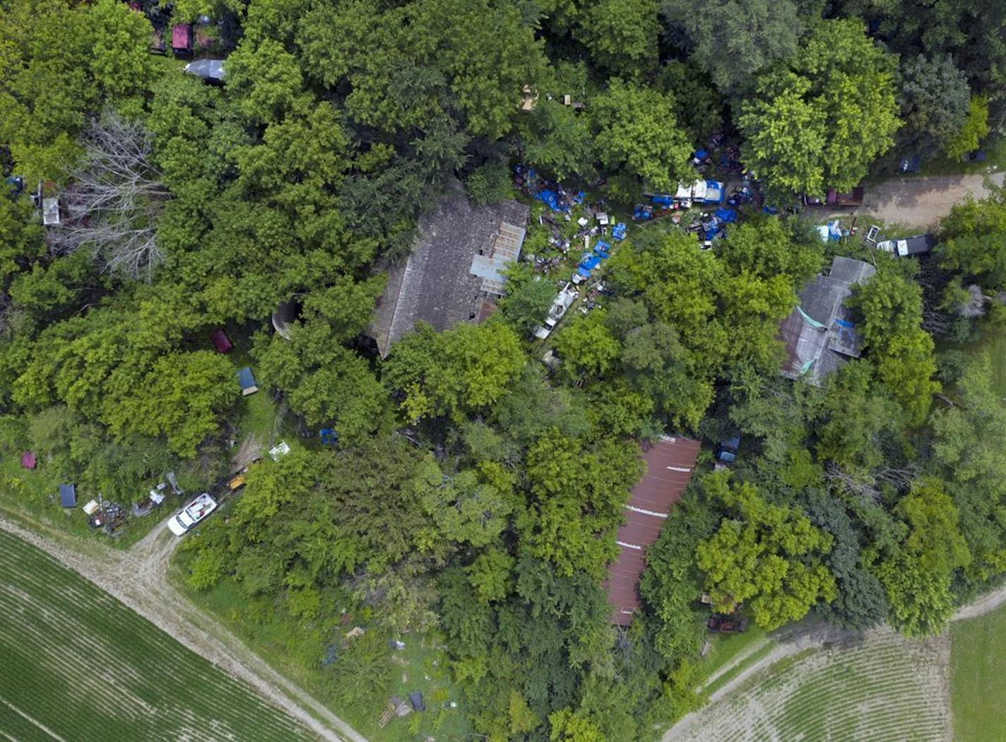 Suburbs are being saddled with problem properties and aren't entirely sure what to do about it. In one case in Shakopee shown here, property owner Gerald Schmitz's has been cited 20 times and even gone to jail for cluttering his yard with numerous junked vehicles, yet nothing has changed.