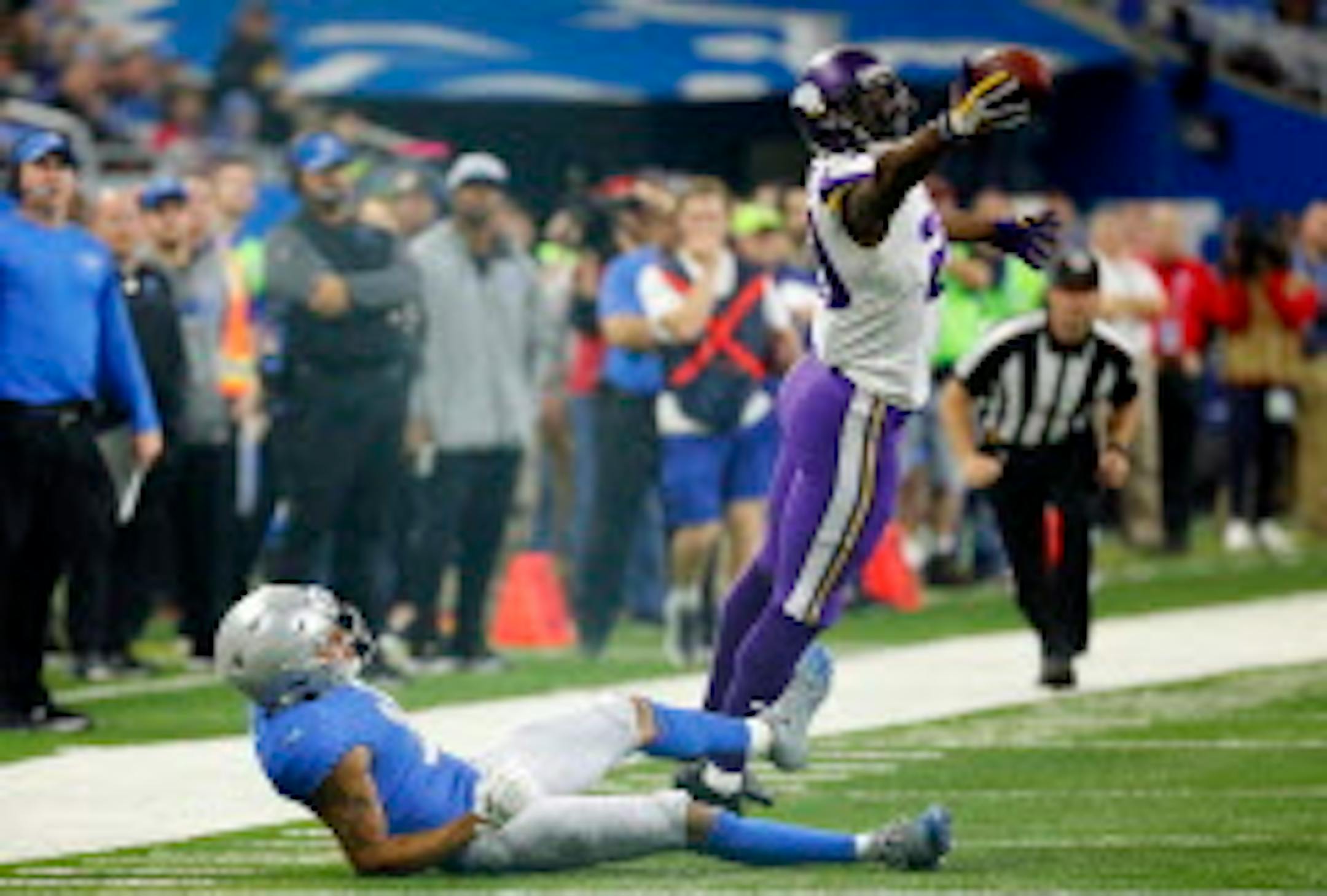 FILE - In this Thursday, Nov. 23, 2017, file photo, Minnesota Vikings cornerback Xavier Rhodes (29) intercepts a pass intended for Detroit Lions wide receiver Marvin Jones during the second half of an NFL football game in Detroit. The Vikings let cornerback Captain Munnerlyn sign with the Carolina Panthers in free agency, but their pass coverage hasn't slipped with Rhodes, Mackensie Alexander, Trae Waynes and Terence Newman helping to hold together a quality group. (AP Photo/Rick Osentoski, File)