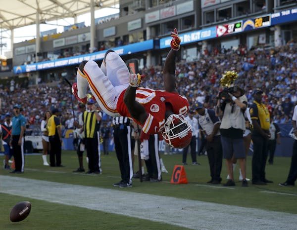 Kansas City Chiefs wide receiver Tyreek Hill celebrates after scoring during the second half of an NFL football game against the Los Angeles Chargers 