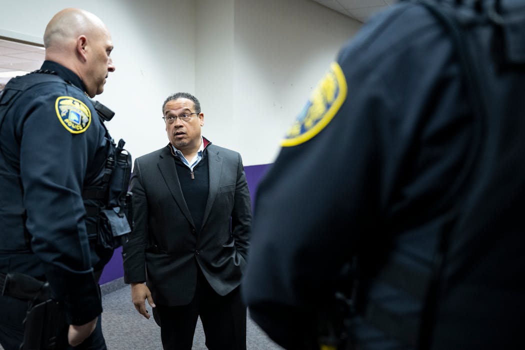 Minnesota Attorney General Keith Ellison speaks with Brooklyn Park Police Chief Mark Bruley Wednesday, April 5, 2023 at Shiloh Temple in Minneapolis, Minn.