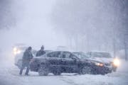 This scene was repeated many times throughout Minnesota in Monday's snowstorm.