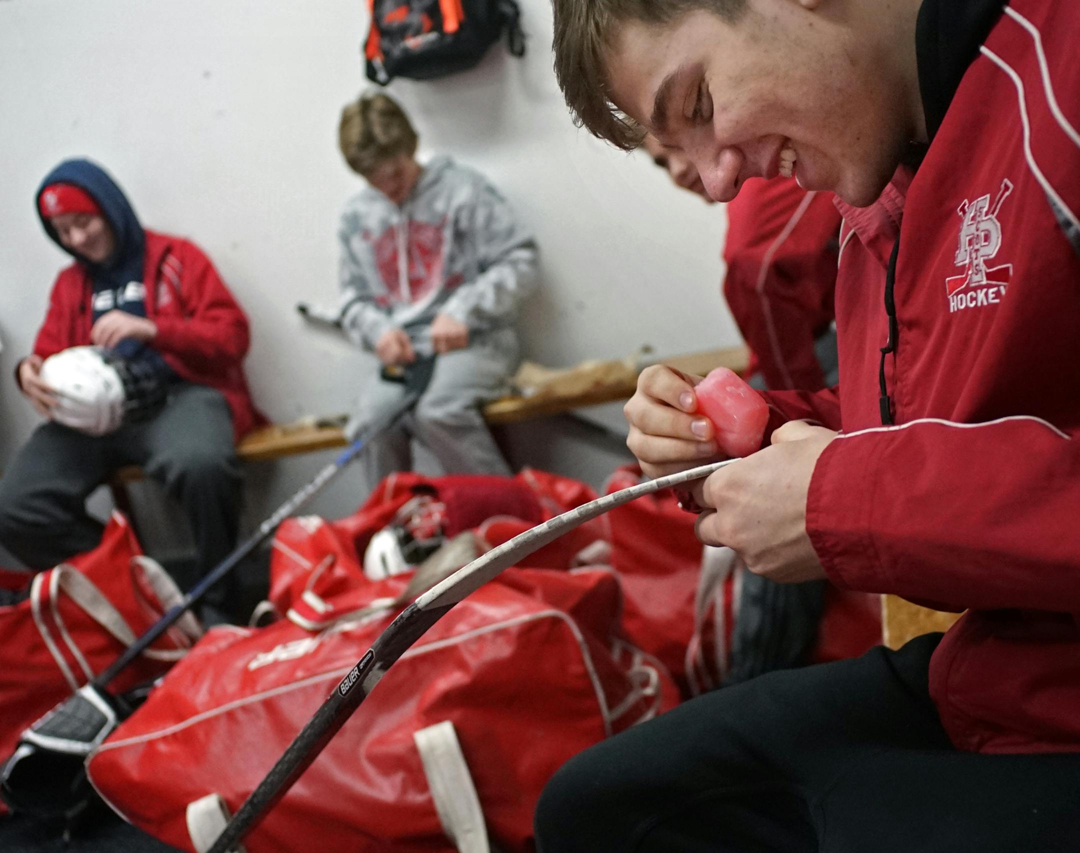 At the Charles M. Schulz - Highland Arena Complex, the Scots get ready for some time on the ice. Sophomore Lee Froelich, a defenseman preps his hockey stick.] rtsong-taatarii@startribune.com/ Richard Tsong-Taatarii
