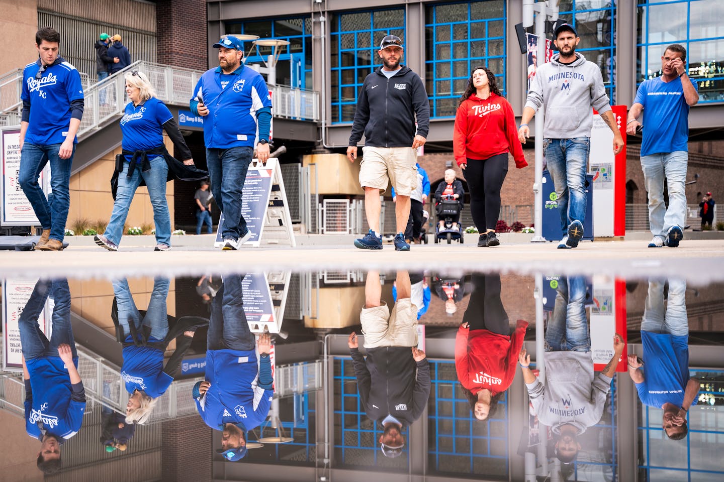 A group of Twins fans head into Target Field before a baseball game in downtown Minneapolis on Tuesday.