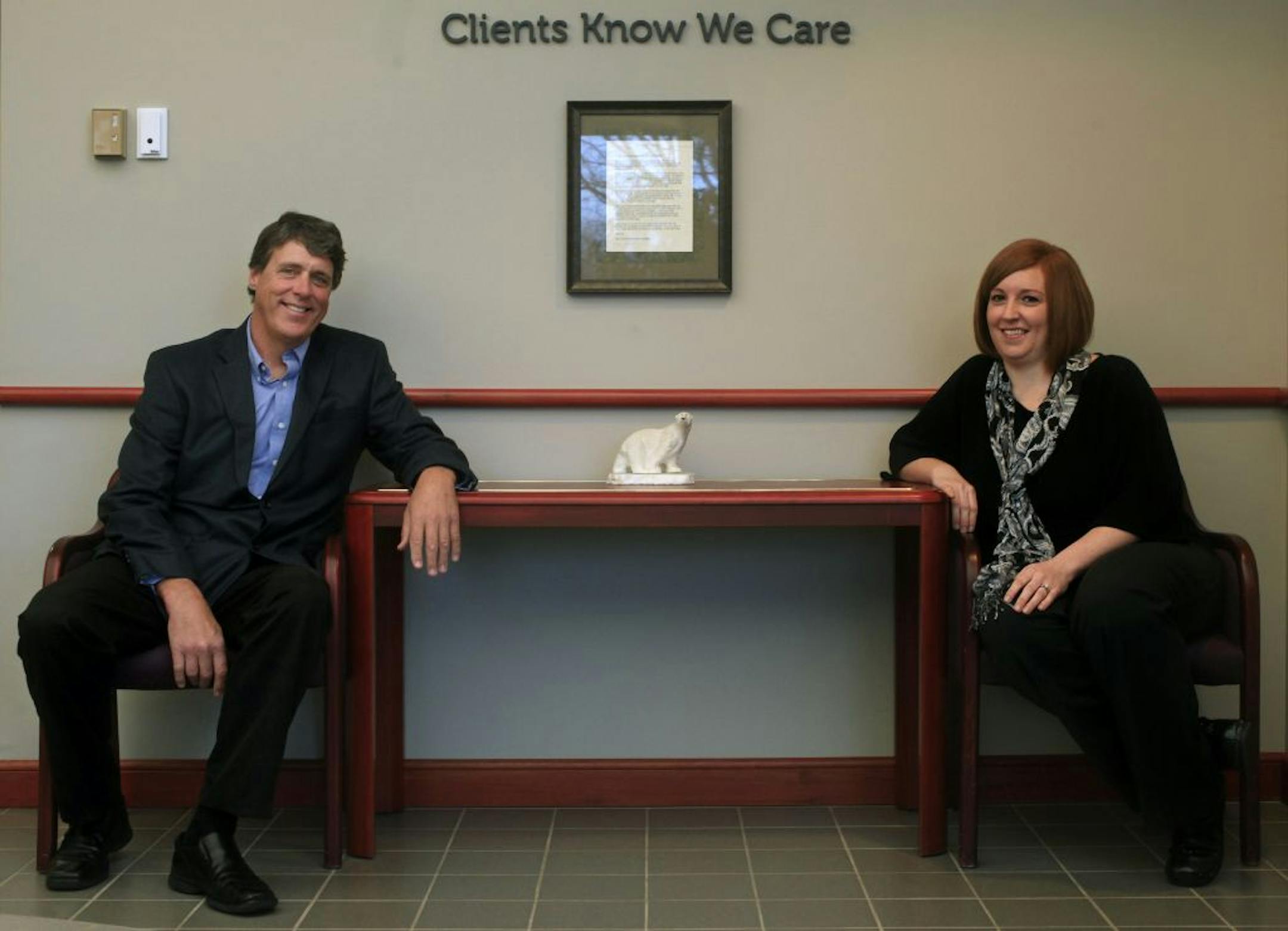 CEO Jim Redpath and Sarah Gengenbach, a principal at accounting firm HLB Tautges Redpath in the lobby of their White Bear Lake, MN office on November 5, 2012.
