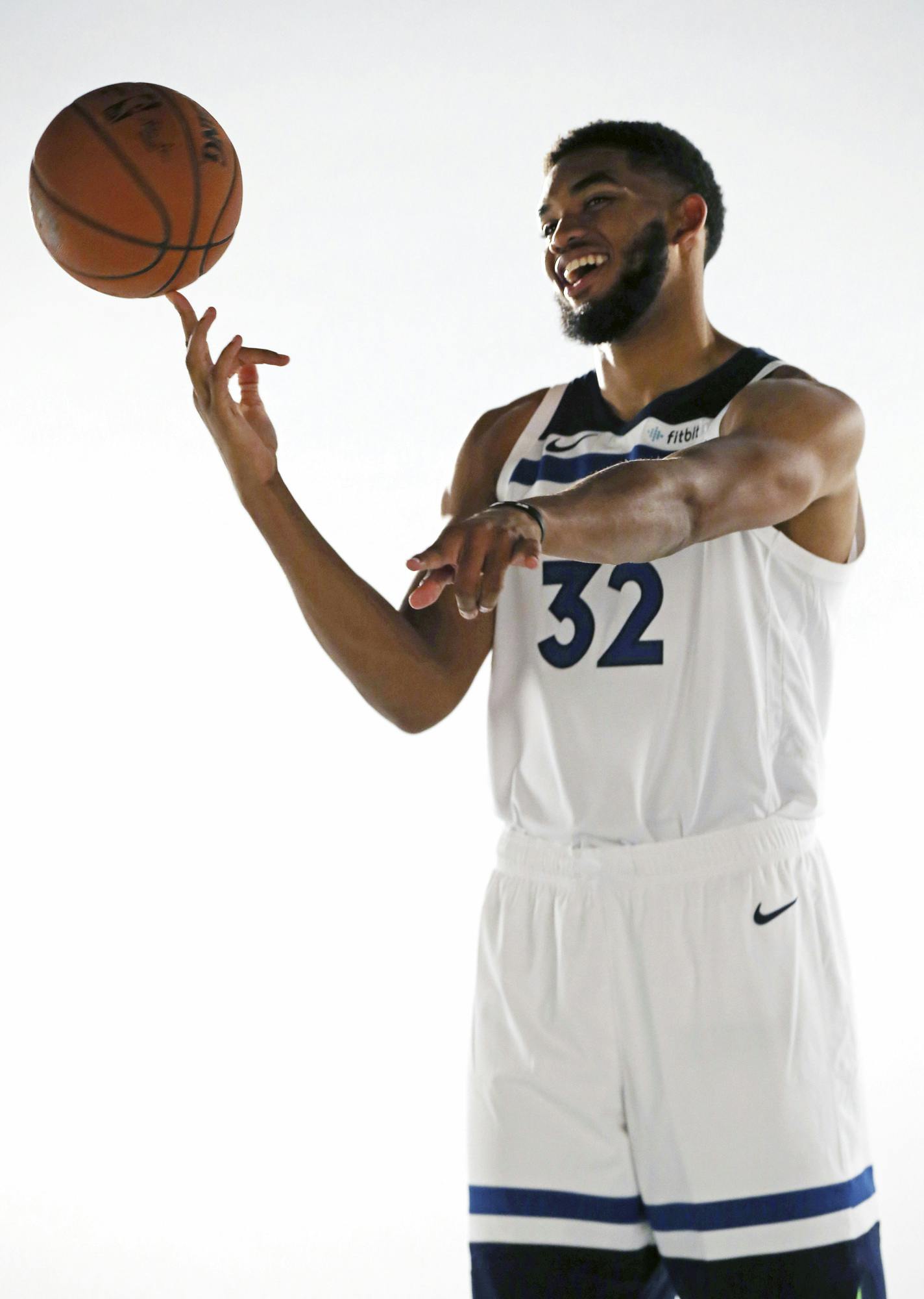 Minnesota Timberwolves' Karl-Anthony Towns, who signed a $190 million, five-year contract extension, poses for a photo during the NBA basketball team's media day at Target Center, Monday, Sept. 24, 2018, in Minneapolis. (AP Photo/Jim Mone)