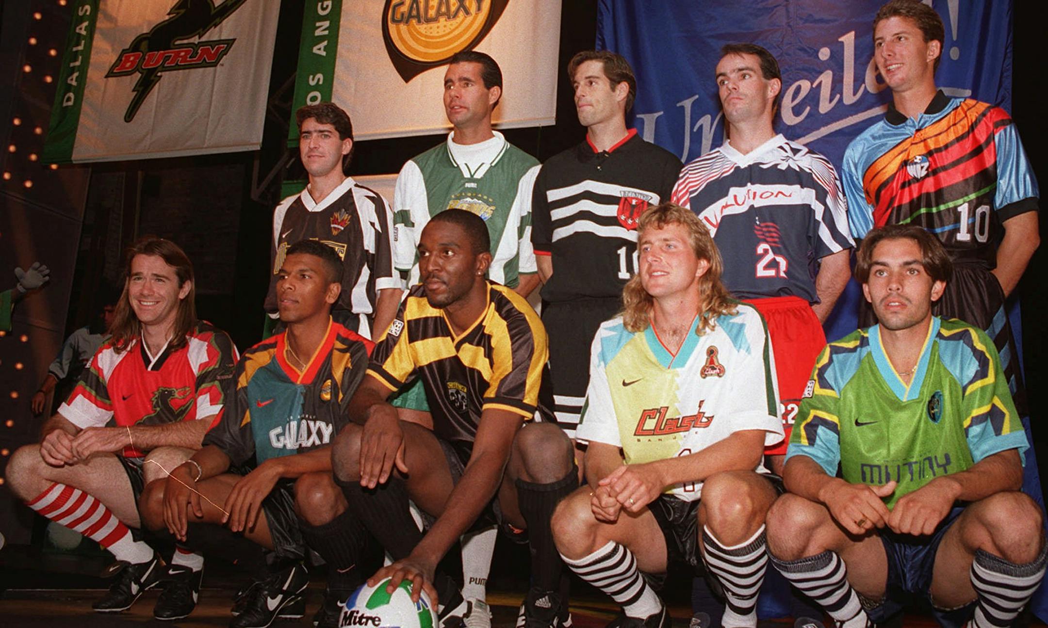Unidentified league players model the new uniforms of Major League Soccer in New York on Tuesday, Oct. 17, 1995. The uniforms are, front row from left; Dallas Burn, Los Angeles Galaxy, Columbus Crew, San Jose Clash, and the Tampa Bay Mutiny. Second row, from left; NY/NJ Metro Stars, Colorado Rapids, Washington D.C., New England Revolution, and Kansas City Wiz. (AP Photo/Marty Lederhandler) ORG XMIT: MIN2016040816503127