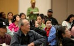 Audience members, some receiving language interpretation in Hmong and Karen, listened to St. Paul mayoral candidates during a forum in April that focu