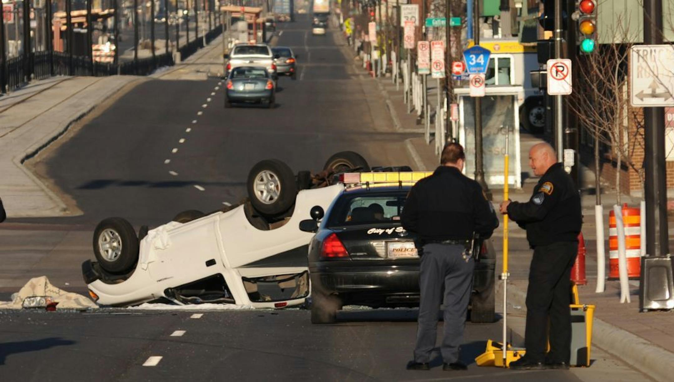 A police chase ended with the fleeing car hitting a pickup truck, which flipped over at the intersection of Marion St. and University Ave. in St Paul on April 3, 2013.