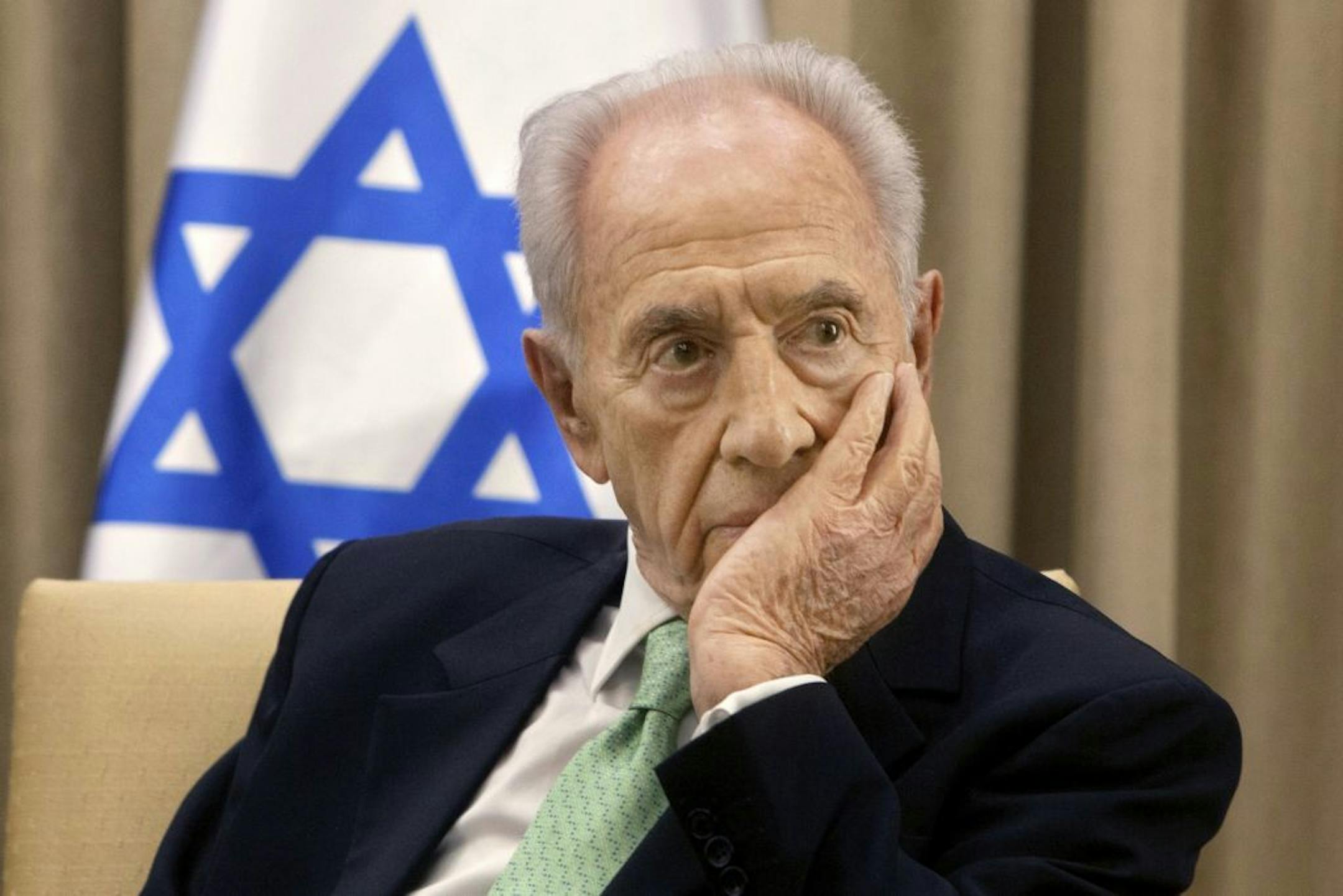 FILE - In this Oct. 28, 2013, file photo, Israel's President Shimon Peres, listens during a meeting at the president's residence in Jerusalem. A source close to former Israeli President Shimon Peres said Tuesday, Sept. 27, 2016 that his condition has deteriorated two weeks after suffering a major stroke. The source did not disclose any details about Peres� worsening condition.