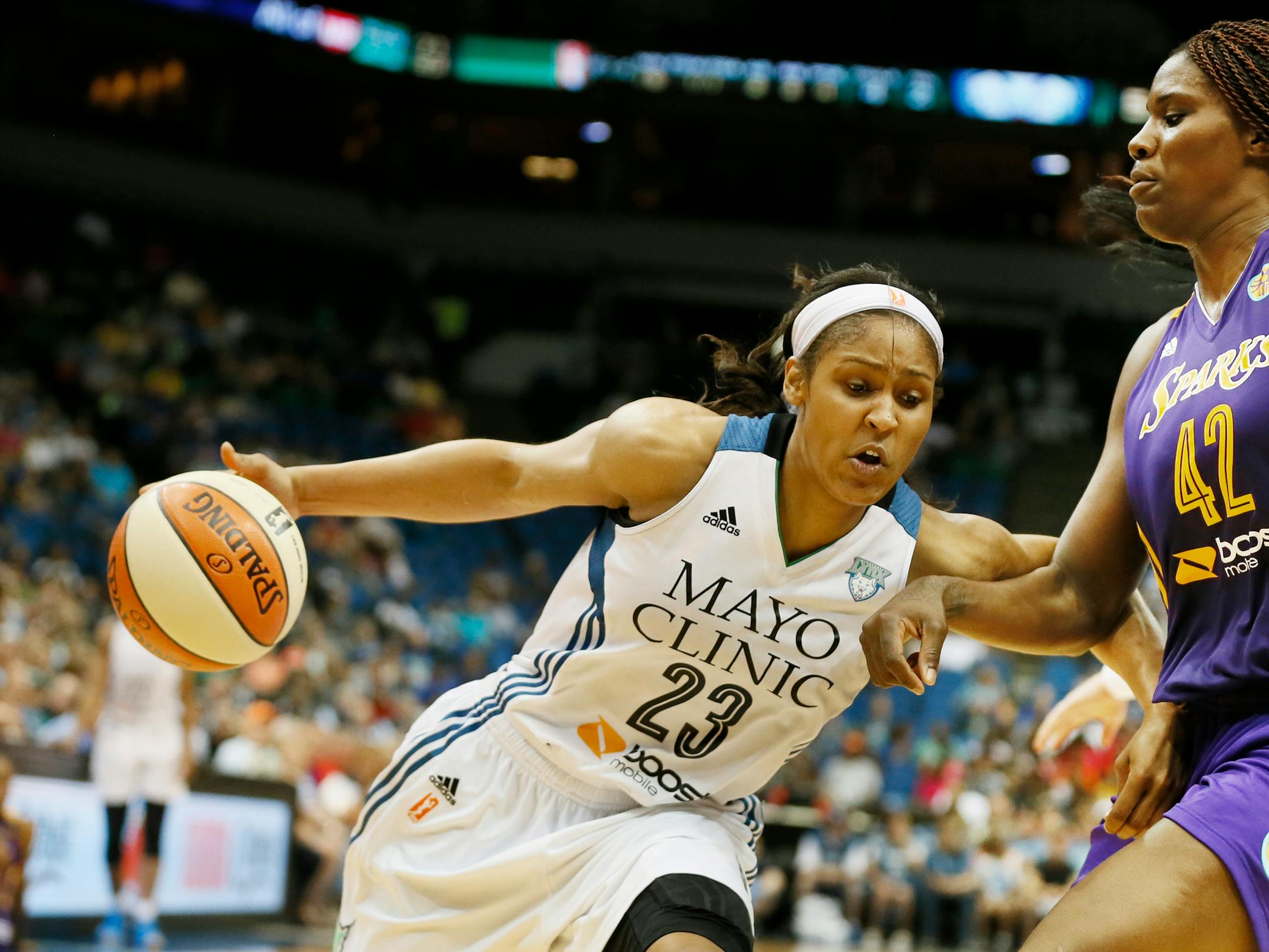 In this file photo, Maya Moore drove to the lane on Sparks Jantel Lavender during WNBA action between the Minnesota Lynx and Los Angeles Sparks at Target Center Tuesday July 8, 2014, in Minneapolis.