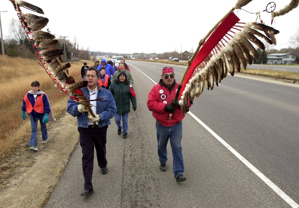 Glenn Wasicuna of Prior Lake, left, and Bear, of Lame Deer, Mont., led a group of walkers and cars during the Dakota Commemorative March. 