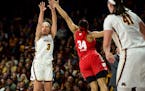 Destiny Pitts hit a 3-pointer while being defended by Wisconsin forward Imani Lewis last month.