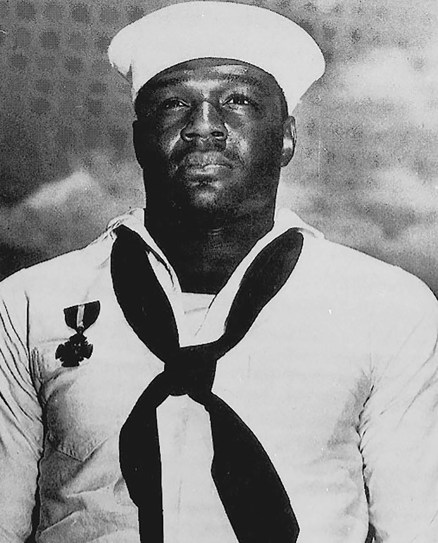 A photo provided by the National Archives of Doris Miller, who was the first African-American sailor to receive the Navy Cross &#x2014; for his bravery during the Japanese attack on Pearl Harbor &#x2014; and who is now set to be further recognized by having a CVN-81 aircraft carrier named in his honor. Miller, whose official duties included cooking and shining shoes, operated an antiaircraft machine gun during the attack on Pearl Harbor. (National Archives via The New York Times) -- FOR EDITORIA