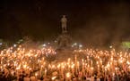 Torch-bearing white supremacists rally around a statue of Thomas Jefferson near the University of Virginia campus in Charlottesville, Aug. 11, 2017. 