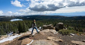 A hiker took in the view of Island Lake from the Land of Lakes overview on Oct. 4, 2023, on the Grand Mesa outside Grand Junction, Colo. The Land of L