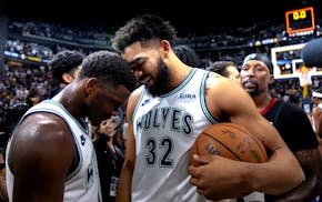 Anthony Edwards (5) and Karl Anthony Towns (32) of the Minnesota Timberwolves celebrate at the end of game of Game 7 against Denver.