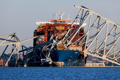 Wreckage of the Francis Scott Key Bridge rests on the container ship Dali, Saturday, March 30, 2024, in Baltimore.