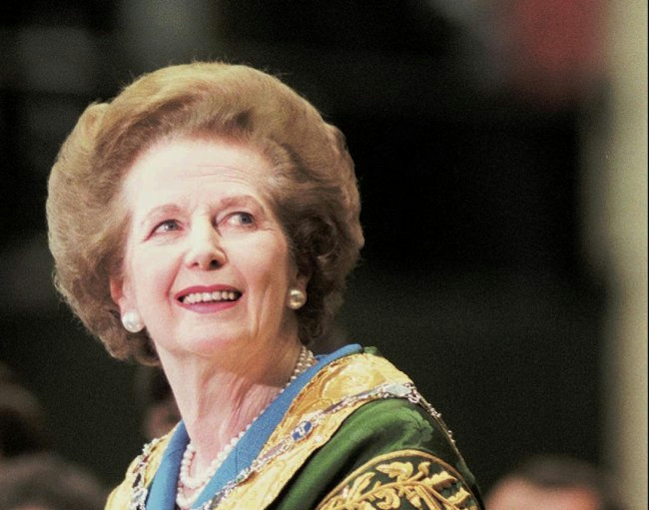 Former British Prime Minister Margaret Thatcher smiles as the audience gives her a standing ovation before her commencement address at William and Mary Hall in Williamsburg, Va., Sunday, May 11, 1997. In a speech Monday, the Iron Lady said the Labor Party won two weeks ago partly by adopting policies of the Conservative Party she led to power in 1979, including privatization and lower taxes.