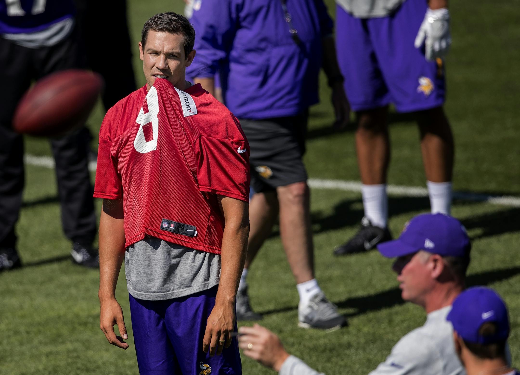 Minnesota Vikings quarterback Sam Bradford listened to offensive coordinator Pat Shurmur during the morning practice.