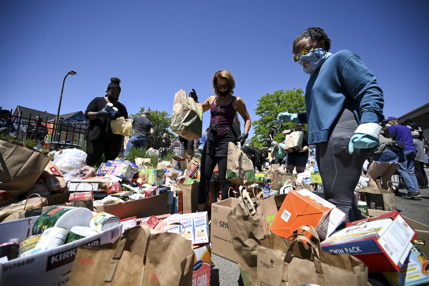 Dozens of volunteers processed donated items outside U.S. Bank on West Broadway in Minneapolis on Saturday.