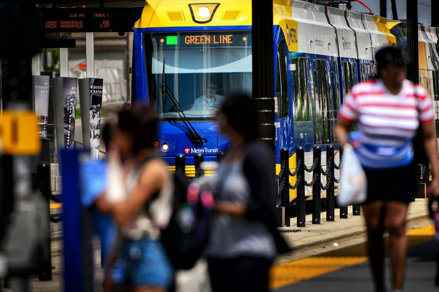 Passengers get on and off the light rail at the Capitol / Rice Street Station, Green Line light rail in St. Paul.