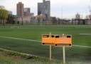 Signs announce the closure of the soccer fields at Minneapolis' East Phillips Park because of the COVID-19 pandemic on May 1. All city recreation cent