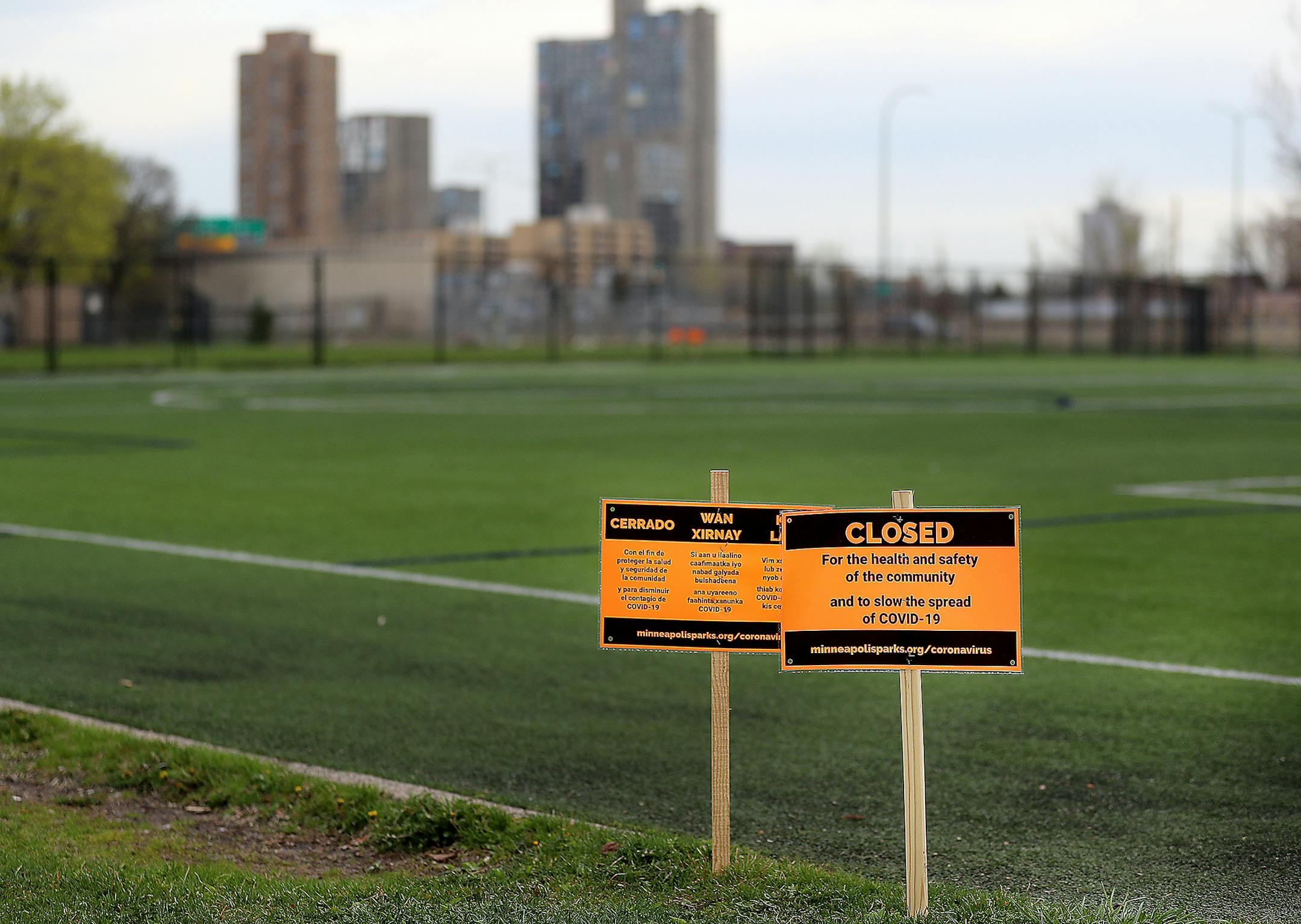 Signs announce the closure of the soccer fields at Minneapolis' East Phillips Park because of the COVID-19 pandemic on May 1. All city recreation centers, program buildings, playgrounds, courts, skate parks and athletic fields were closed. DAVID JOLES • david.joles@startribune.com COVID-19 news of the day.
