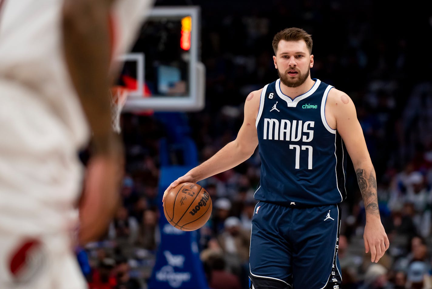 Dallas Mavericks guard Luka Doncic (77) brings the ball upcourt in the first half of an NBA basketball game against the Portland Trail Blazers in Dallas, Friday, Dec. 16, 2022. (AP Photo/Emil Lippe)