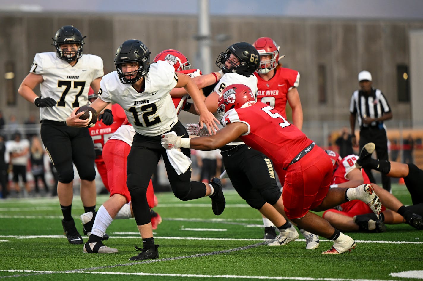 Andover quarterback Landyn Nelson (12) rushes the ball against Elk River Friday, Sept. 9, 2022 during the first half of a football game at Elk River High School in Elk River, Minn. ] aaron.lavinsky@startribune.com