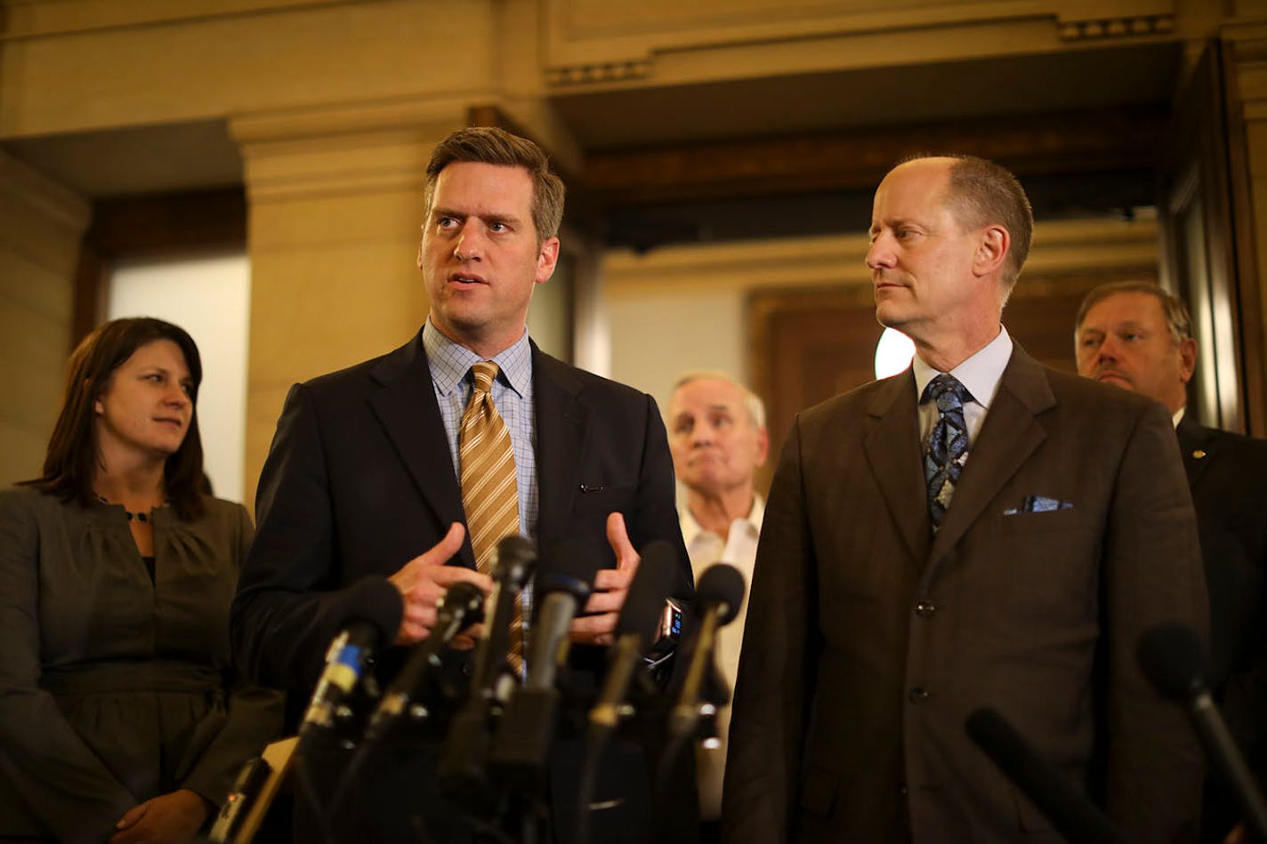 Rep. Kurt Daudt, speaker of the House, announced that an agreement had been reached between the leadership and the Governor, rear, to convene a special session at 12:01 a.m. Tuesday to take on the outstanding budget bills and the tax bill. With Daudt were Rep. Joyce Peppin, House Majority Leader, left, Governor Mark Dayton, Senator Paul Gazelka, Senate Majority Leader, and Senator Tom Bakk, Senate Minority Leader, from left.